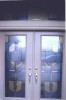 Custom designed front door using etched and colored vinyl.
